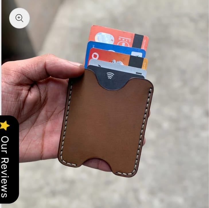 The Maverick Card Sleeve in brown leather, flat lay