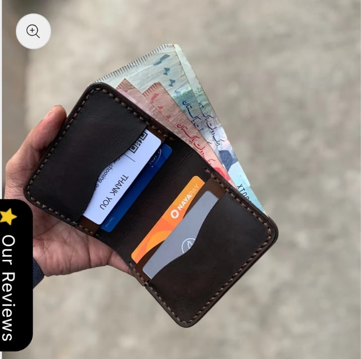 The Rancher Bifold Wallet open, showing card slots and bill compartment